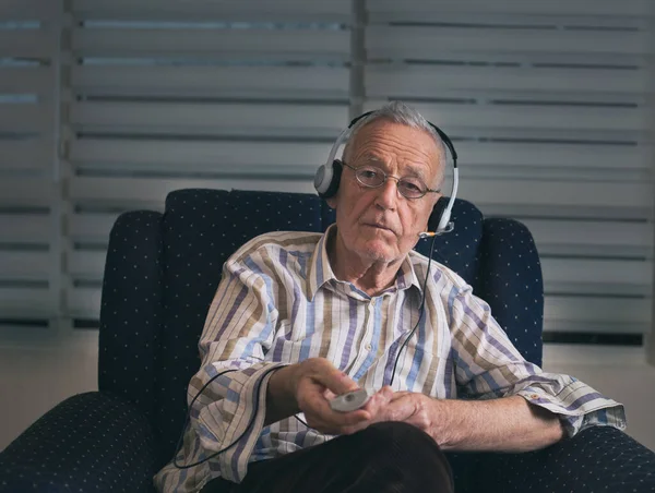 Senior Man Sitting Armchair Holding Remote Control Changing Channels — Stock Photo, Image