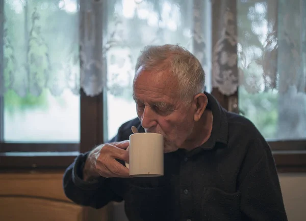 Old Man Drinking Tea Cup Home Front Window — Stock Photo, Image