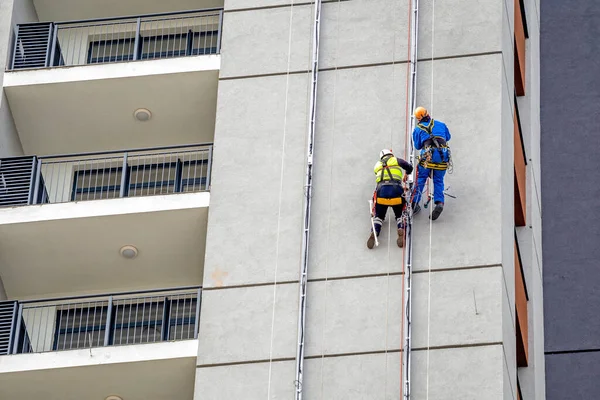 Two Workers Hang Building Doing Electrical Installations Residential Buildings Men Stock Image