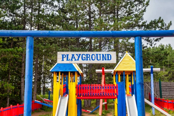 Wooden Children Playground Surrounded Green Trees Focus Wooden Board — Stock Photo, Image