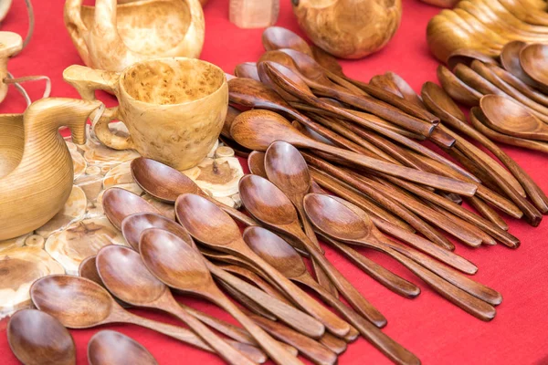 Wood utensils or kitchen on red background.