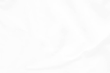 Beyaz kumaş arka plan soyut. Kumaş kırışık ve dalgalanıyor. Malzemeler tekstil montajında kullanılır.