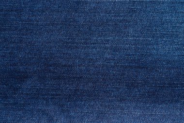 Makro, Denim mavi kot doku detayları yakın çekim. Kumaş veya tekstil deseni soyut arka plandır. Konsept tasarım moda ve retro stlye.