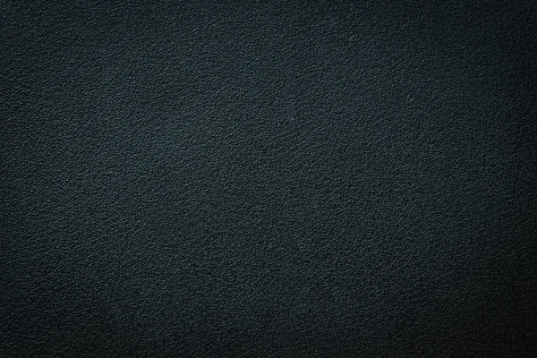 Close-up of black gray plastic material seamless texture. Surface of rough abstract dark black matte background. Design in your work backdrop, concept copy space for text.