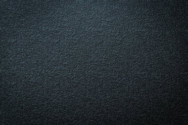 Siyah gri plastik malzeme dikişsiz doku yakın çekim. Pürüzlü soyut koyu siyah mat arka plan yüzeyi. Çalışma zemininizde tasarım, metin için kavram kopyalama alanı.