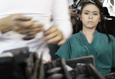 Beautiful, asian women wedding Makeup and hairdressing by make-up artist in dressing room. Bridal portrait soft focus. Concept of love, Marriage wedding, with copy space