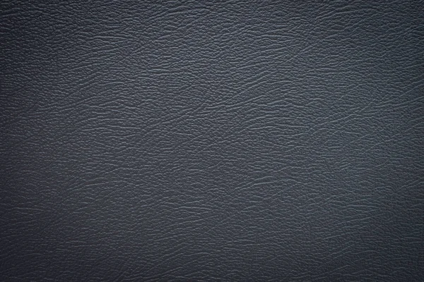Close-up of Black gray leather texture. Surface of rough abstract dark black matte background. Design in your work backdrop, concept copy space for text.