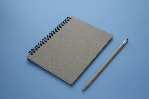 Top View Brown Spiral Notebook Pencil Isolated Blue Background Design — Stock Photo, Image