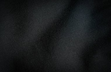 Siyah kumaş, lüks, koyu gri arka plan soyut. Malzemeler tekstil montajında kullanılır. Kalıpların kumaş dokusunu detaylandır. Tasarım, vignette efektli zarafet, metin yerleştirme için ücretsiz kopya alanı.
