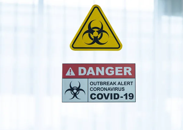 COVID-19, Corona Virus outbreak quarantine and epidemic spread healthcare concept. Caution and danger of infection COVID-19 coronavirus outbreak control sign at quarantine room in hospital