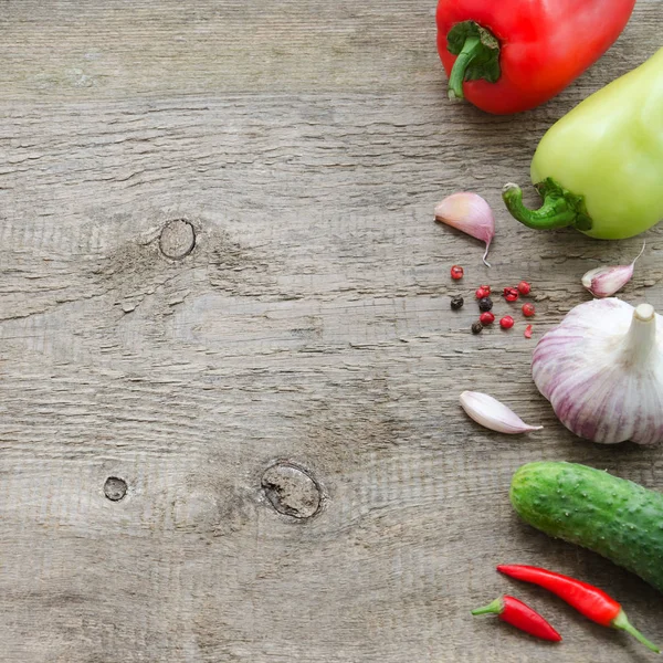 Frame of vegetables: cucumber, tomato, pepper, onion, garlic. Healthy food, Vegan or Harvest concept Copy space composition