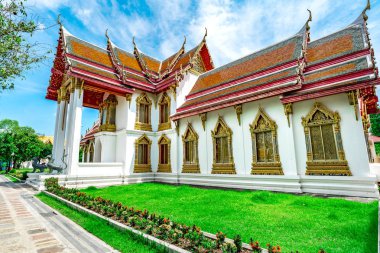Beautiful Buddhist Temple At Wat Benchamabophit or Marble Temple Landmark And Major Tourist Attraction In Bangkok Thailand     clipart