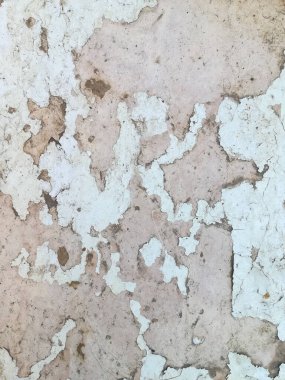 Beyaz boyalı eski bir kontrplak dokusu. beyaz boyanın arkaplanı parça parça dökülüyor