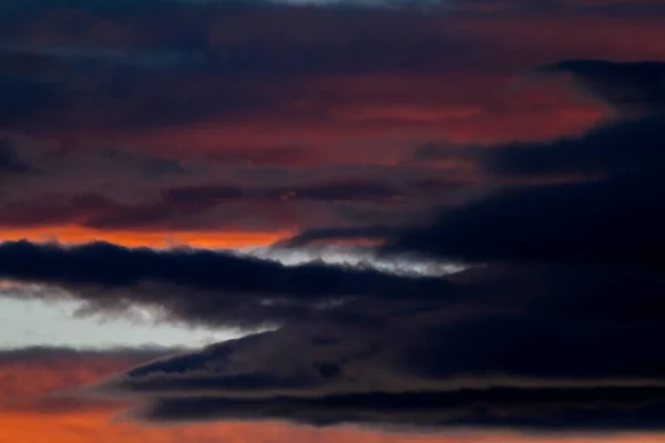 Colorful cloud patterns with golden hour light.