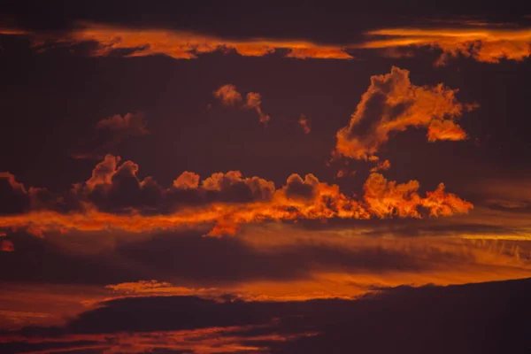 Colorful cloud patterns with golden hour light.