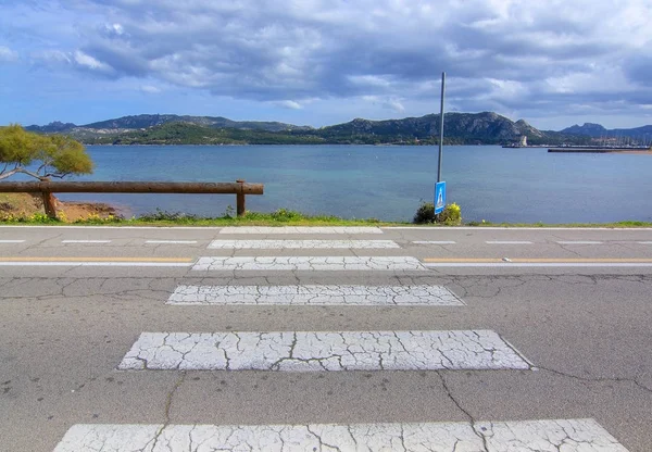 Pedestrian crossing zebra walk leading into water abstract — Stock Photo, Image