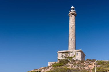 Cabo de Palos, Cartagena, Murcia Özerk Bölgesi içinde İspanyol belediyesinde cape deniz feneri. Mevsim yaz ve gökyüzü mavi derin