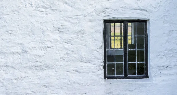 White Stone Wall Black Window Frame — Stock Photo, Image