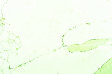 Mermer kayrak yeşil damarlar veya taneler ile beyaz arka plan gösteren parlak yeşil mermer desen. Bu, tezgah malzemesi olarak kullanılan, renkli modifiye edilmiş bir kesme mermer kayraktır..