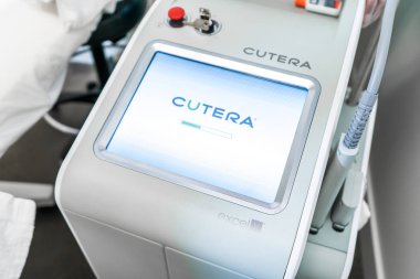 Excel V vascular laser by Cutera laser for skin rejuvenation, removing scars, veins, skin discoloration and more. Shows screen starting up for procedure. clipart