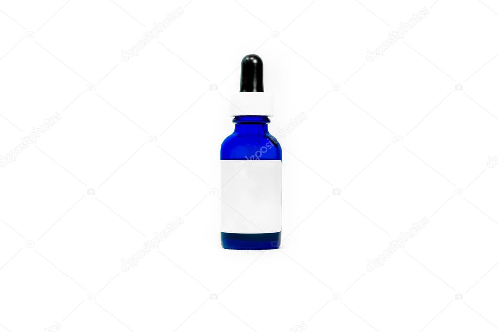 Blue glass eyedropper bottle with blank white label for adding your own text or logo. Bottle is transparent and has a squeeze-top lid for measuring liquid treatment applications.
