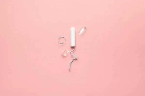 Unpacked tampon on a soft pink background. Modern female intimate gynecological hygiene. Eco zero waste concept. Copy space place for text. Flat lay — Stock Photo, Image