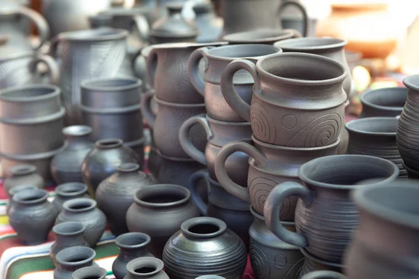 Ternopil, Ukraine, 24-07-2019. Selective focus. Dark black ceramic clay pottery. Traditional pottery fair. Ukrainian Carpathian pots — Stock Photo, Image