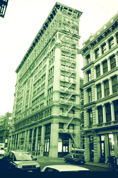 Old buildings with firestairs in green — Stock Photo, Image