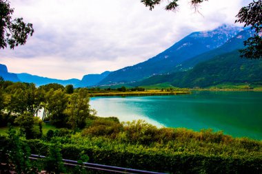 photo of Lake Caldaro enclosed in the mountains in Bolzano Italy clipart
