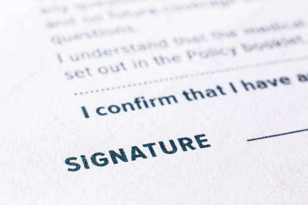 Close up word signature on business agreement form. Policy documents, registration, employment and commercial startup concept.