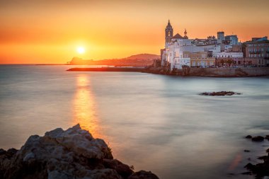 Sitges is a town near Barcelona in Catalunya, Spain. It is famous for its beaches and nightlife. clipart