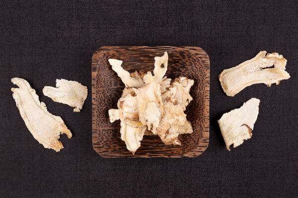 Angelica root used in chinese traditional herbal medicine over black background. Radix angelicae sinensis, Dang gui.