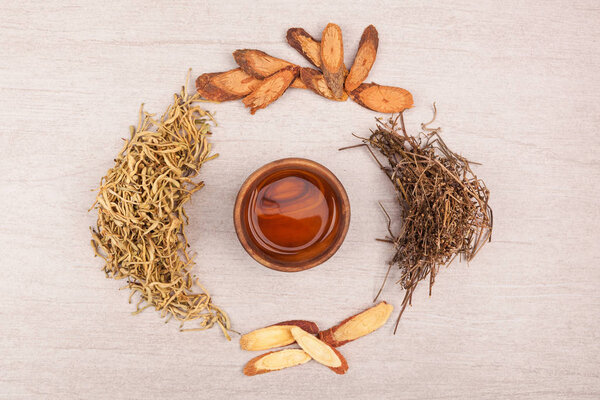 Traditional chinese medicine tea help to stop cough. TCM on gray background top view.
