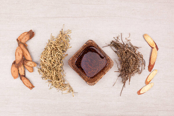 Traditional chinese medicine tea help to stop cough. TCM on gray background top view.