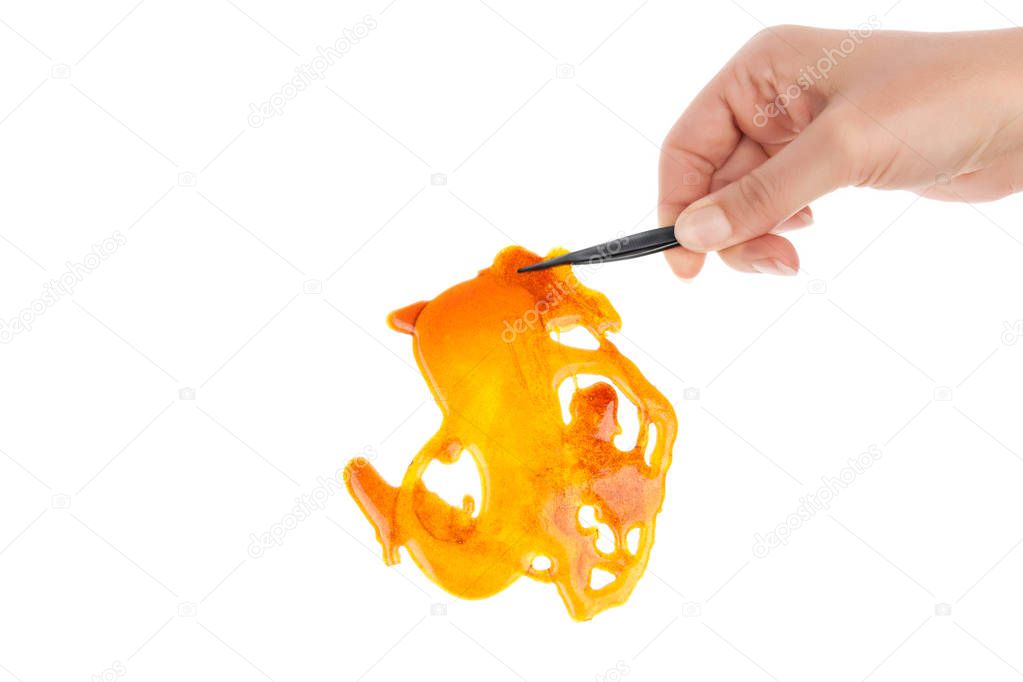 Marijuana concentrate shatter isolated on white background.