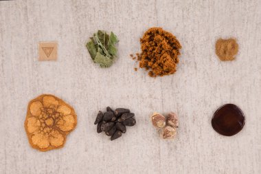 Psychedelic compounds. LSD acid blotter, iboga root bark, syrian rue, ayahuasca, banisteriopsis caapi, hawaiian baby woodrose, salvia divinorum and morning glory seeds. Alternative medicine. Top view, knolling. clipart