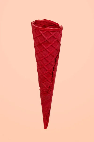 Red ice cream cone isolated.