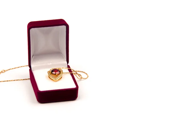 Gold pendant with precious stones in the form of a heart — Stock Photo, Image