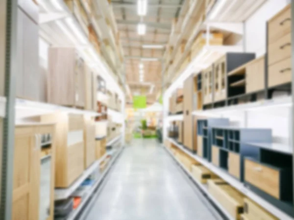 Blur furniture store interior for background. blurry industrial furniture merchandise inventory and wood material