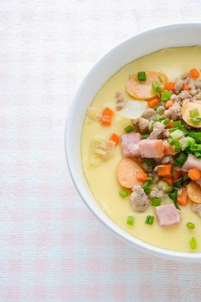 Steamed egg custard cuisine in a white bowl with minced pork, sa