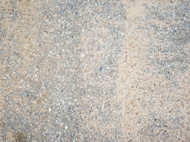 Arka plan olarak kullanılan yolda küçük taşlar ve kumlar bulanık