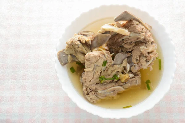 Slow Cooker Pork Bone Broth, it 's simmered for many hours to ext — стоковое фото