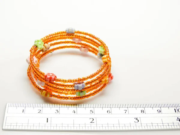 Multi-colored bracelets with beads. Colourful child's bead brace — Stock Photo, Image