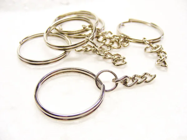 Metal ring and chain for key and trinket on white background. — 스톡 사진