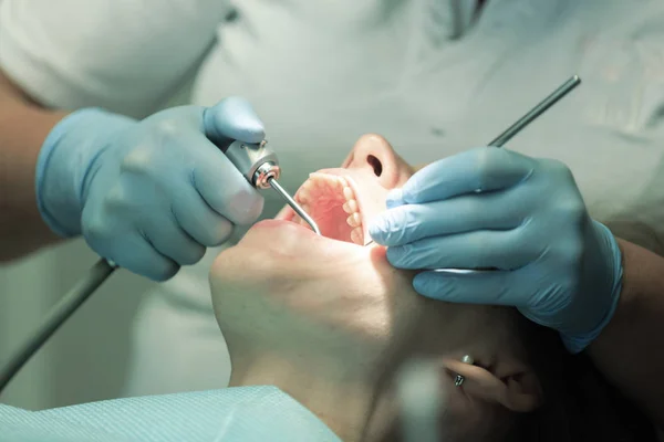 Close-up medical dentist procedure of teeth cleaning