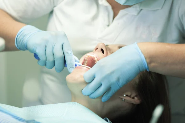 Close-up medical dentist procedure of teeth cleaning