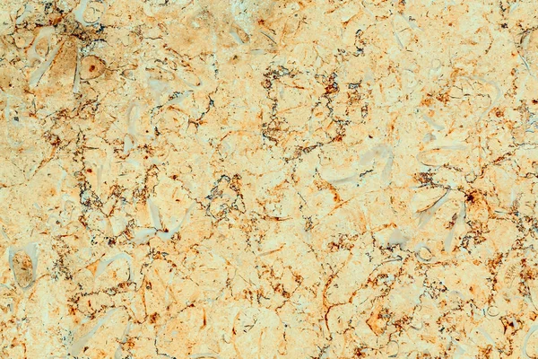 Полірований жовтий мармур з помаранчевими та сірими смугами, текстура — стокове фото