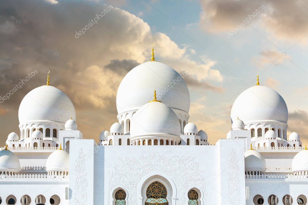Grand Mosque in Abu Dhabi on the background of dramatic clouds in the sky