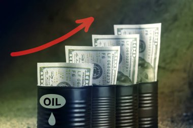 Several barrels of oil with dollars and a red arrow up - concept of higher oil prices clipart