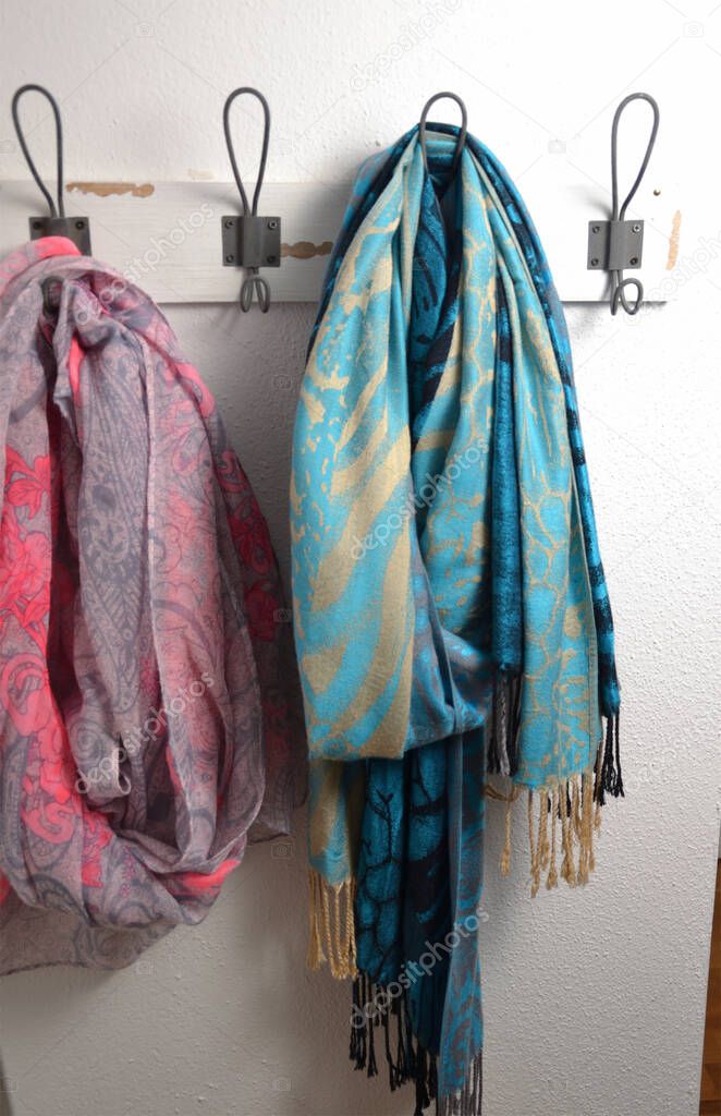 colorful scarves on a wardrobe